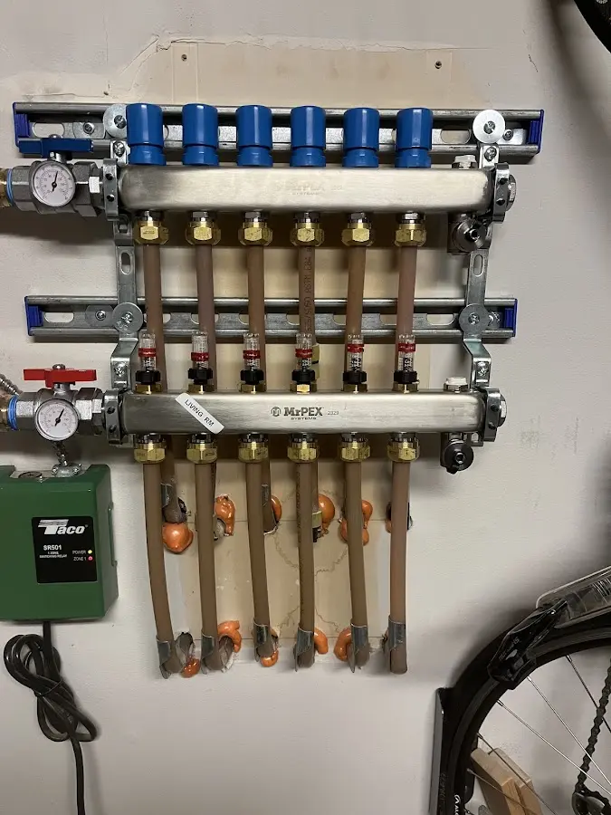 Plumber performing Water Heater Repair at a residential property in Kronenwetter